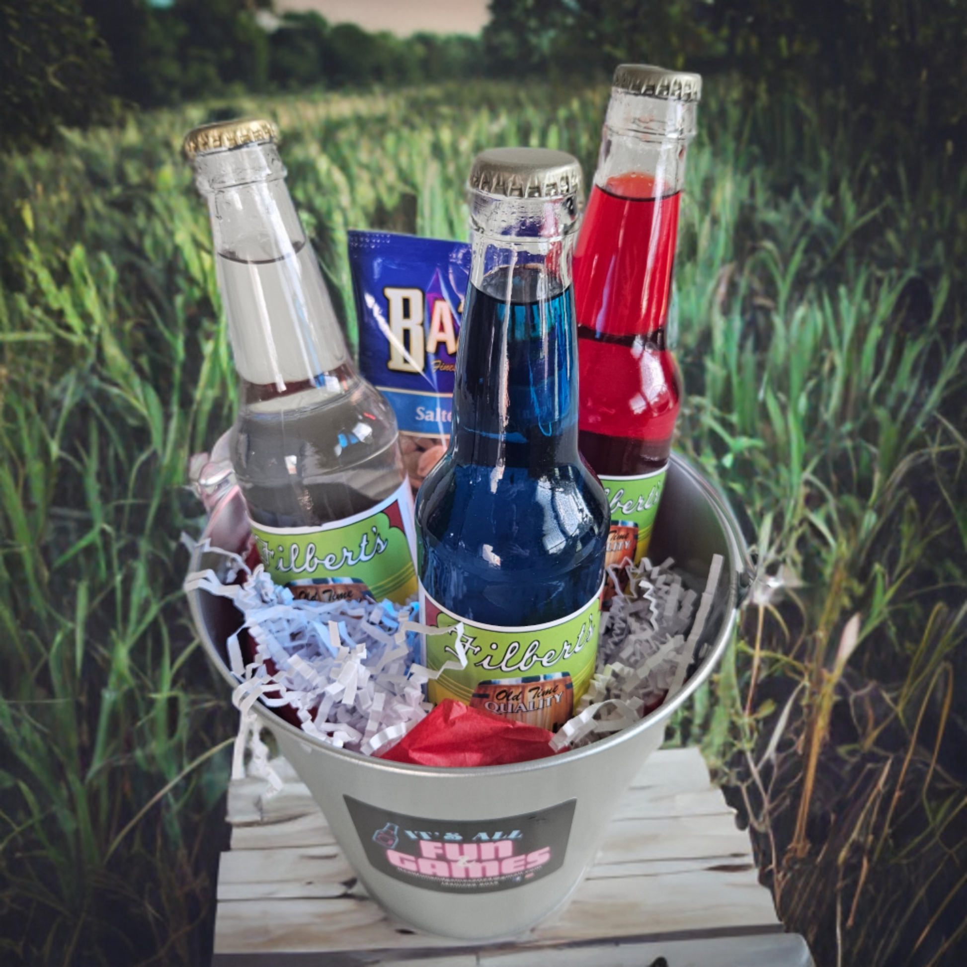 Decorative image of three flavored sodas in a bucket. 